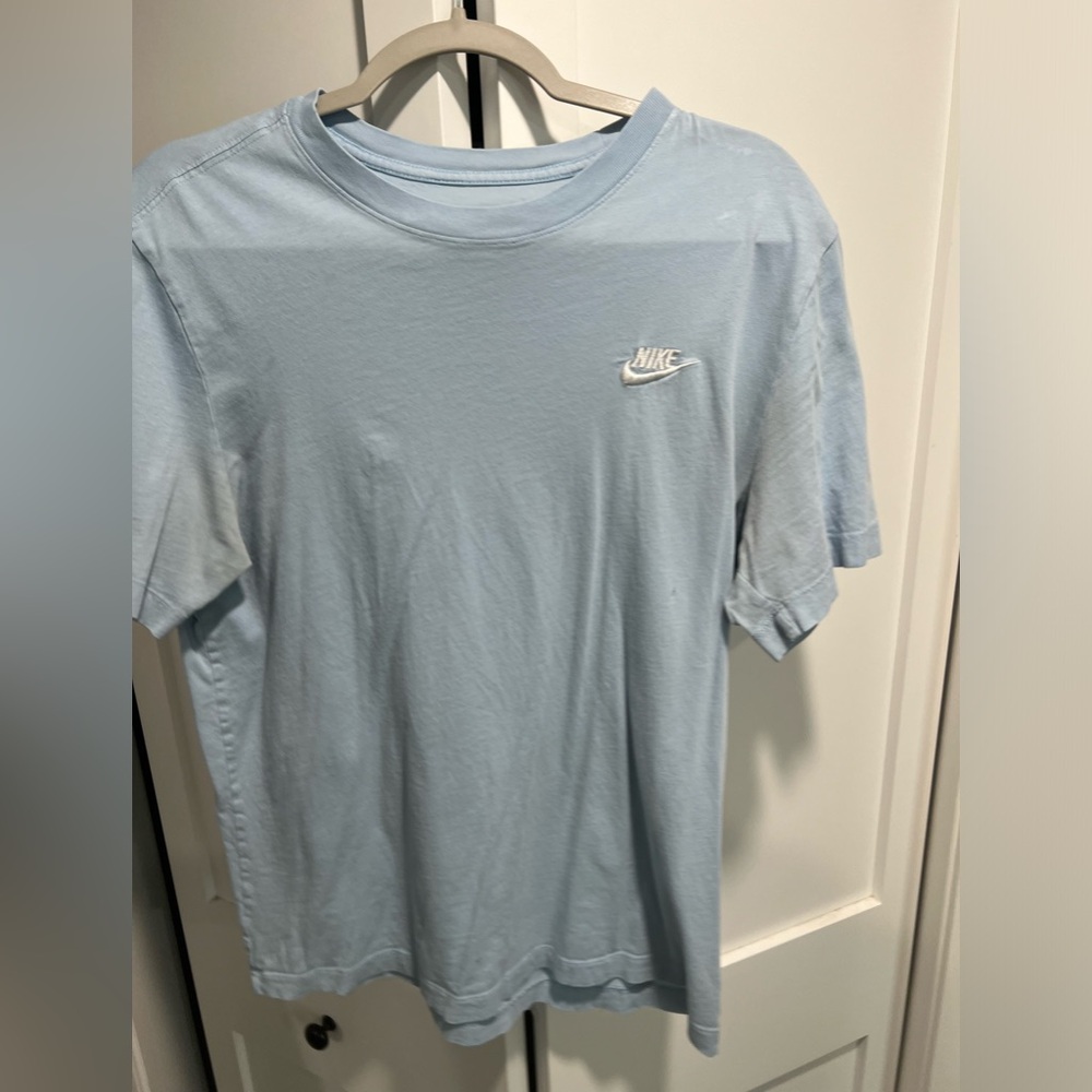 Medium light blue nike shirt